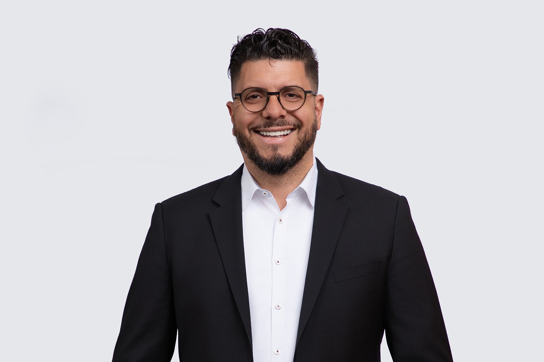 Malek Macaron Headshot May 2026 - 2